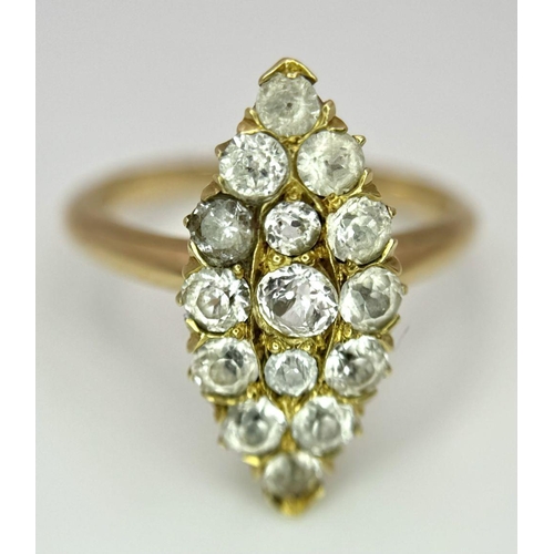 177 - An 18K Yellow Gold Diamond Ring. Marquise shape with 15 diamonds. Size K. 3.4g total weight.