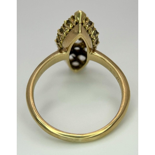 177 - An 18K Yellow Gold Diamond Ring. Marquise shape with 15 diamonds. Size K. 3.4g total weight.