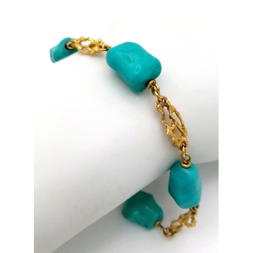 184 - A Natural Turquoise and 18K Gold Bracelet. 21cm. 18.4g total weight.