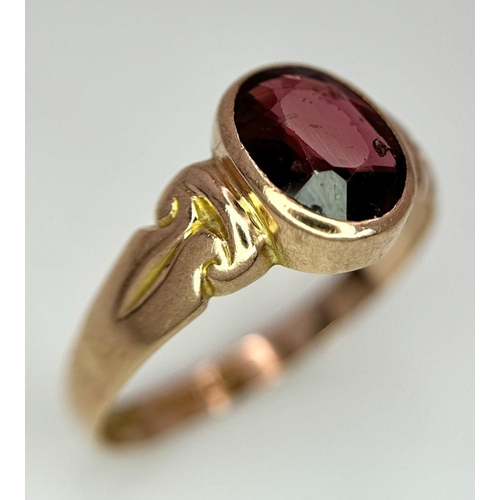 205 - A Vintage 9K Yellow Gold Garnet Ring. Full UK hallmarks. Size T 1/2. 3.4g total weight.