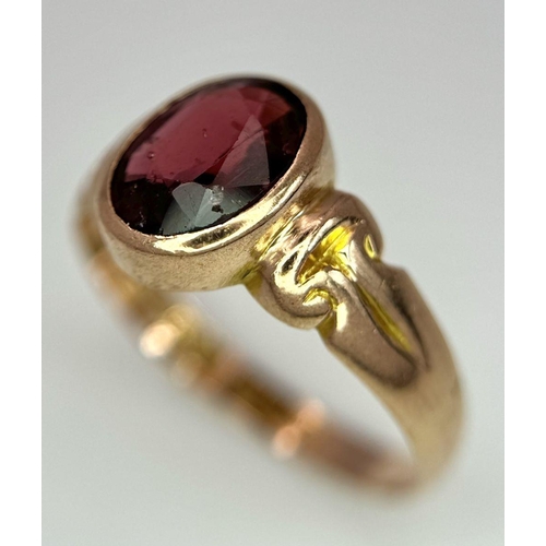 205 - A Vintage 9K Yellow Gold Garnet Ring. Full UK hallmarks. Size T 1/2. 3.4g total weight.