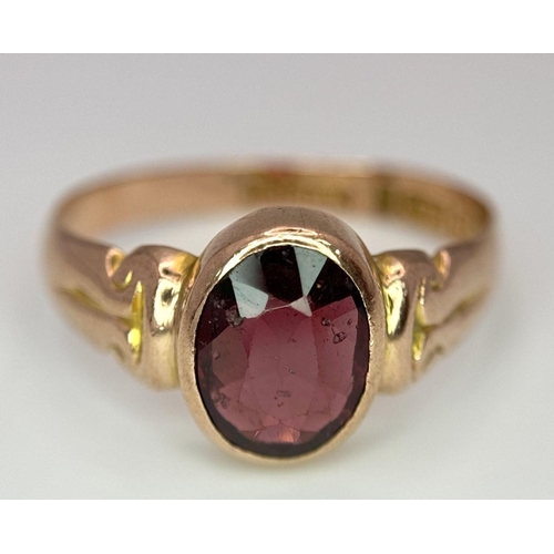 205 - A Vintage 9K Yellow Gold Garnet Ring. Full UK hallmarks. Size T 1/2. 3.4g total weight.