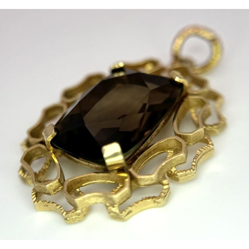 212 - A Vintage 9K Yellow Gold Smoky Quartz Pendant. 4cm. 6.7g total weight.