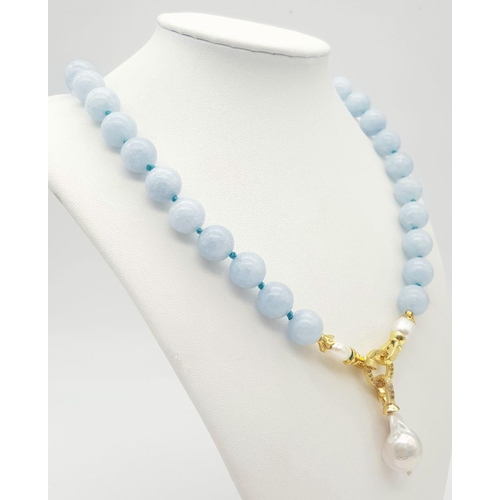 290 - An Aquamarine Beaded Necklace with a Baroque Pearl Pendant Drop. 12mm beads. 48cm necklace length. 5... 