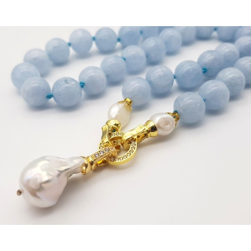 290 - An Aquamarine Beaded Necklace with a Baroque Pearl Pendant Drop. 12mm beads. 48cm necklace length. 5... 