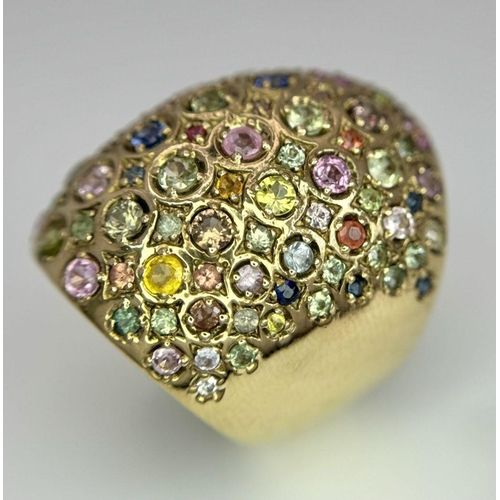 311 - A 9K Yellow Gold Multi-Coloured Sapphire Elongated Dress Ring. Size N 1/2. 13.5g total weight. Comes... 