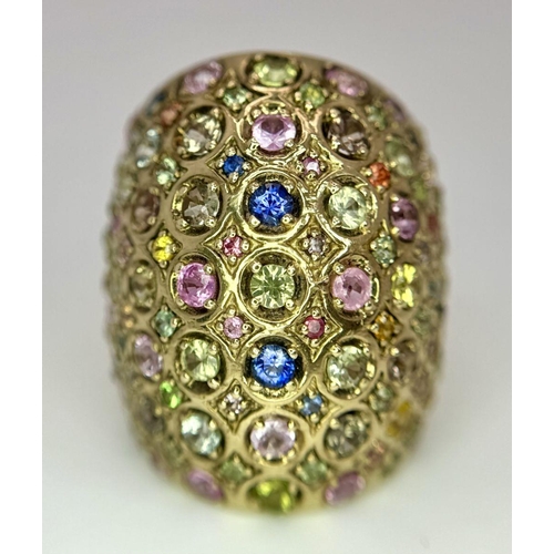 311 - A 9K Yellow Gold Multi-Coloured Sapphire Elongated Dress Ring. Size N 1/2. 13.5g total weight. Comes... 