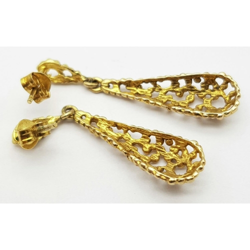 321 - A Pair of 9K Yellow Gold Teardrop Earrings. Pierced decoration. 3.5cm. 2.4g total weight.