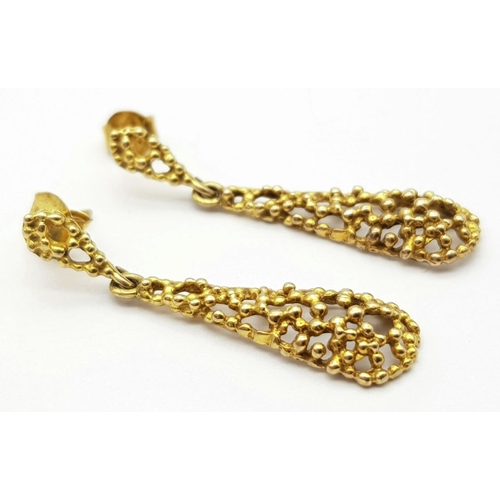 321 - A Pair of 9K Yellow Gold Teardrop Earrings. Pierced decoration. 3.5cm. 2.4g total weight.