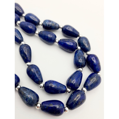 335 - A Lapis Lazuli Teardrop Necklace with Hanging Baroque Pearl Pendant. 46cm necklace length. 4cm penda... 