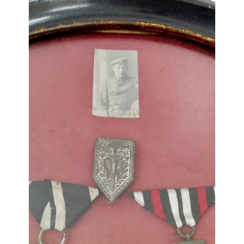 341 - Framed WW1 Imperial German Iron Cross 2nd class and Hindenburg Field Service Cross, along with a pho... 