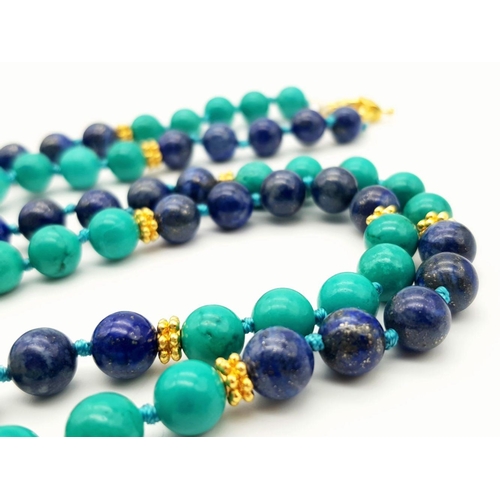 381 - A Lapis Lazuli and Turquoise Beaded Matinee Length Necklace. Gilded spacers and clasp. 88cm necklace... 