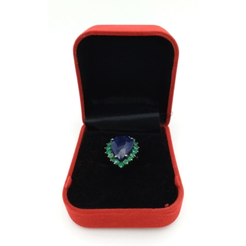 422 - A 10ct Blue Sapphire Ring with 1.70ctw of Emerald Accents. Set in 925 Silver. Size N. Comes with a p... 