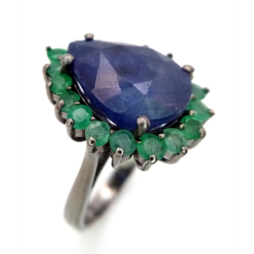 422 - A 10ct Blue Sapphire Ring with 1.70ctw of Emerald Accents. Set in 925 Silver. Size N. Comes with a p... 