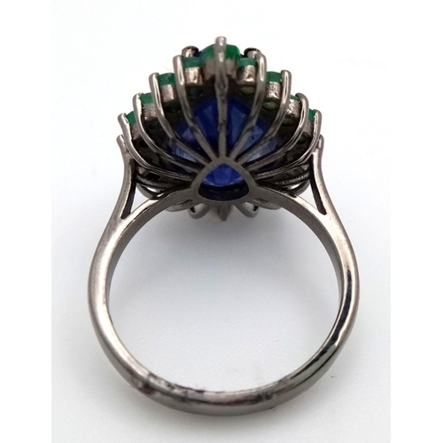 422 - A 10ct Blue Sapphire Ring with 1.70ctw of Emerald Accents. Set in 925 Silver. Size N. Comes with a p... 