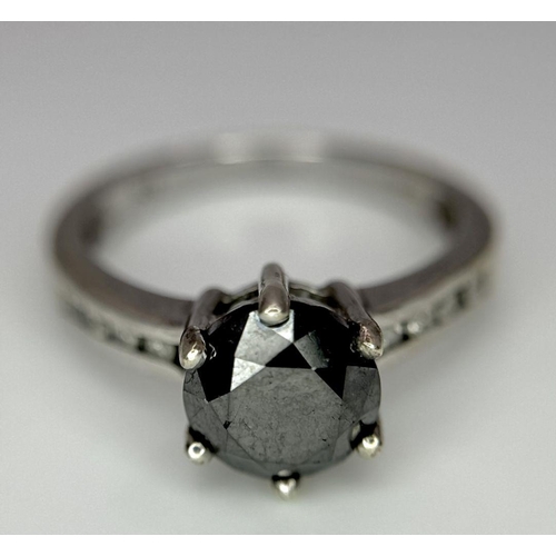 548 - A 9K White Gold and Dark Blue Gemstone Ring with Diamond accents. Size I. 2.4g total weight.