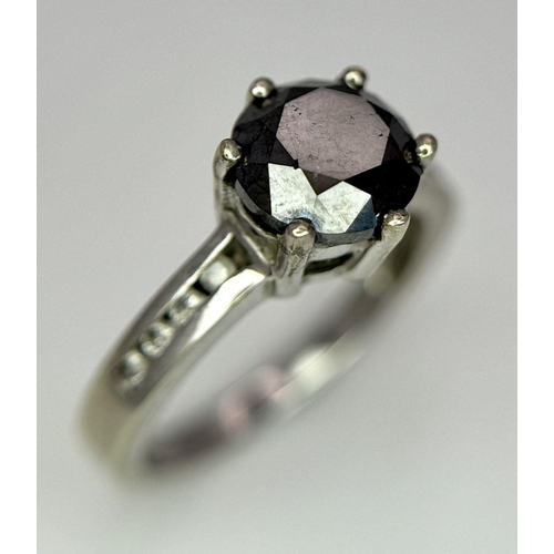 548 - A 9K White Gold and Dark Blue Gemstone Ring with Diamond accents. Size I. 2.4g total weight.