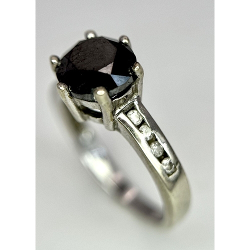 548 - A 9K White Gold and Dark Blue Gemstone Ring with Diamond accents. Size I. 2.4g total weight.