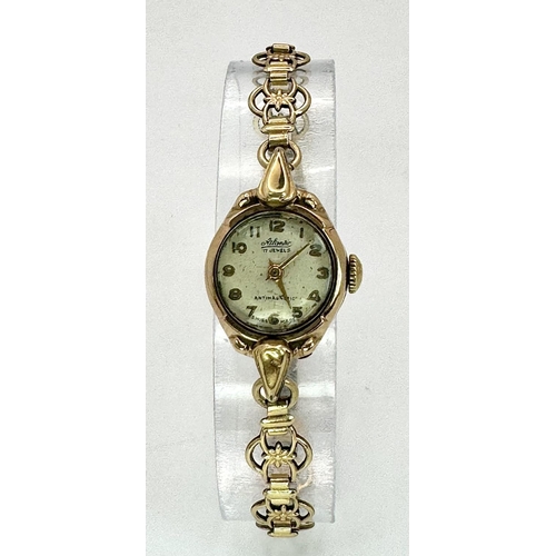 549 - At Atlantic 9K Gold Cased Ladies Watch. Mechanical movement. Works but because of age no guarantees.