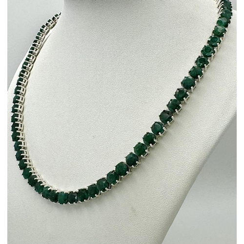 596 - An Emerald Gemstone Tennis Necklace. Round cut. Set in  925 Silver. 44cm length. 50g weight. CD-1363