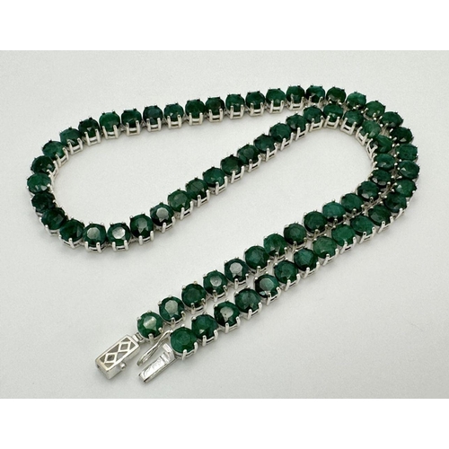 596 - An Emerald Gemstone Tennis Necklace. Round cut. Set in  925 Silver. 44cm length. 50g weight. CD-1363