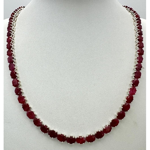 86 - A Ruby Gemstone Tennis Necklace. Oval cuts. Set in 925 silver. 46cm. 40g. CD-1355