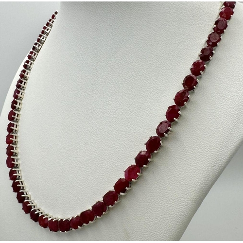 86 - A Ruby Gemstone Tennis Necklace. Oval cuts. Set in 925 silver. 46cm. 40g. CD-1355