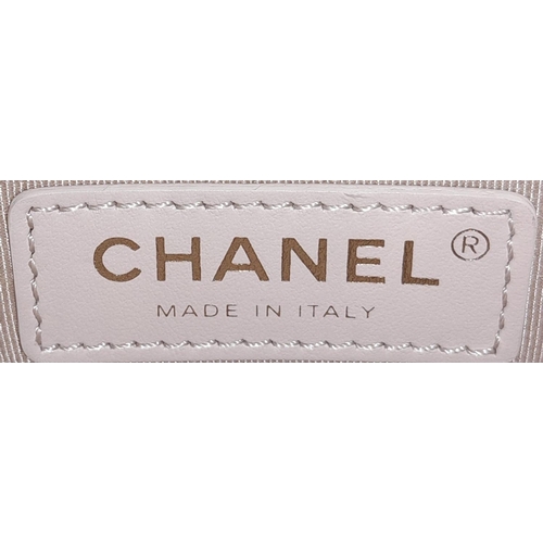 235 - A Chanel Two-Way Chain Shoulder Bag. Beige caviar leather.
Gold tone hardware. Spacious interior wit... 