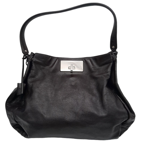 514 - A Celine Dark Brown Shoulder Bag. Leather exterior with silver-toned hardware, single strap, press s... 