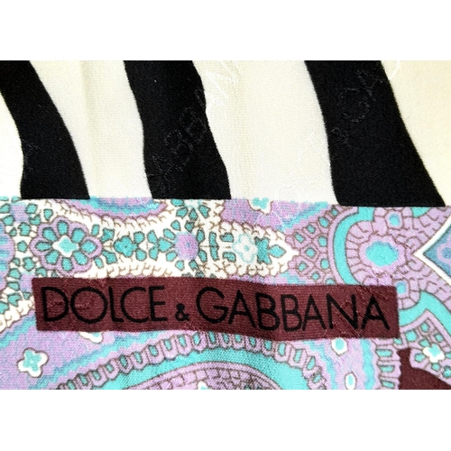 597 - A D&G Zebra and Paisley Print Scarf. Approximately 66cm x 66cm. One small stain but good condition o... 