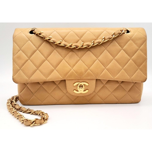 115 - A Beige Chanel Classic Matelasse Double Flap Bag. Quilted leather exterior with gold-toned hardware,... 