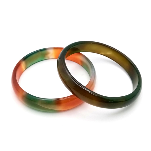 1398 - Two Different Coloured Jade Bangles. Green and multi coloured. 7cm inner diameter.