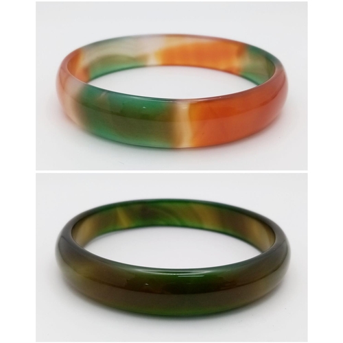 1398 - Two Different Coloured Jade Bangles. Green and multi coloured. 7cm inner diameter.