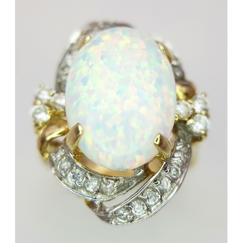 18 - A Breath-Taking 14K Yellow Gold, Diamond and Opal Ring. Large 8ct Opal with an elaborate diamond sur... 