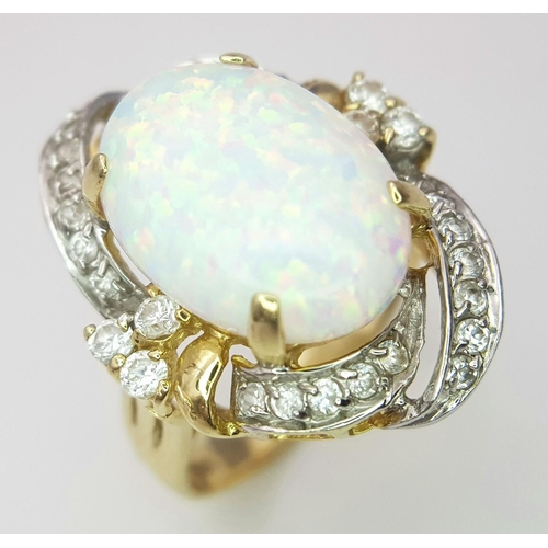 18 - A Breath-Taking 14K Yellow Gold, Diamond and Opal Ring. Large 8ct Opal with an elaborate diamond sur... 