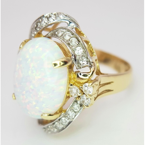 18 - A Breath-Taking 14K Yellow Gold, Diamond and Opal Ring. Large 8ct Opal with an elaborate diamond sur... 