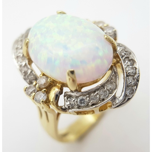 18 - A Breath-Taking 14K Yellow Gold, Diamond and Opal Ring. Large 8ct Opal with an elaborate diamond sur... 