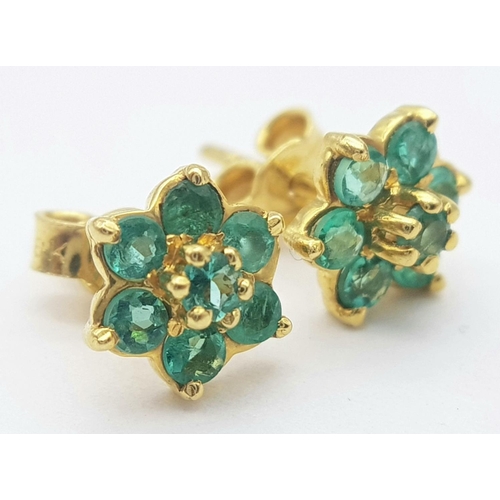 214 - A Pair of 18K Yellow Gold Emerald Stud Earrings. Floral form. 
2g total weight.