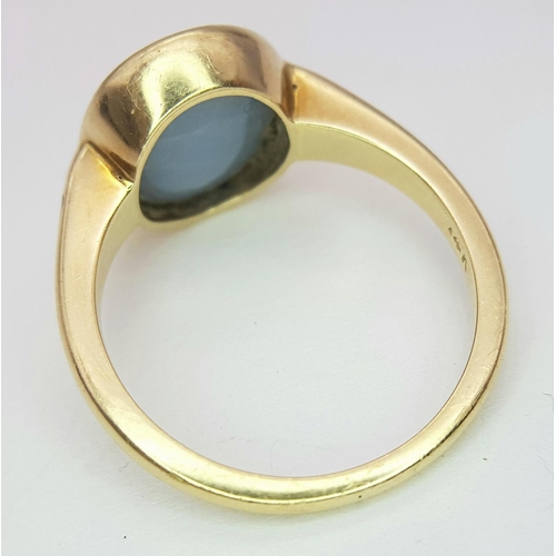 23 - A 14K Yellow Gold Opal Ring. Oval cut opal with good colour play. Size M. 4g total weight.