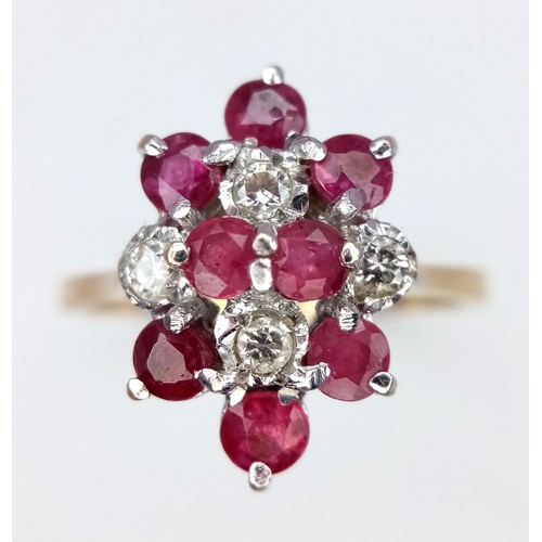 30 - A 9K Yellow Gold Ruby and Diamond Ring. 8 rubies and 4 diamonds. Size M. 2g total weight.