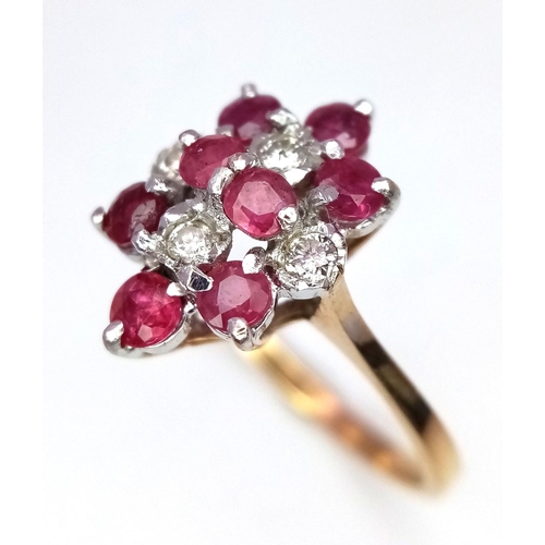 30 - A 9K Yellow Gold Ruby and Diamond Ring. 8 rubies and 4 diamonds. Size M. 2g total weight.