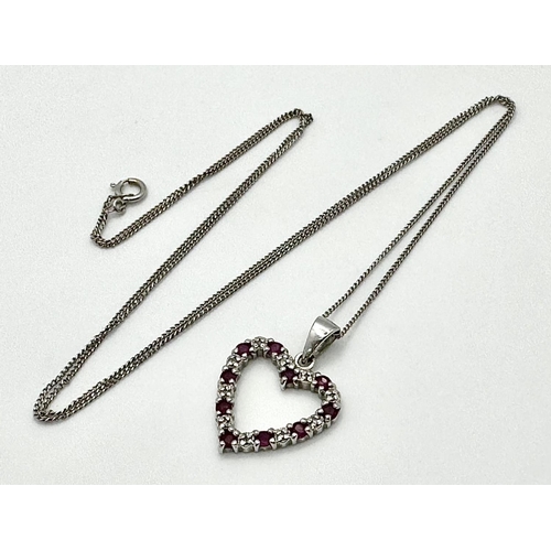 452 - A 9 Carat White Gold Ruby and Diamond Heart Pendant Necklace. 48cm Length Chain. Pendant 1.5cm Wide.... 