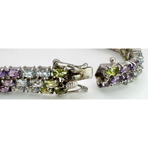 473 - A Sterling Silver Multi Semi Precious Stone Set Bracelet. 19cm Length, 1cm Wide. Set with Oval Cut P... 