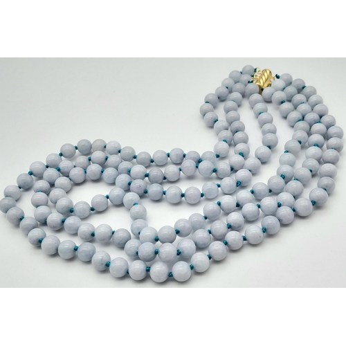 499 - A Three Row Aquamarine Beaded Necklace with Gilded Clasp. 8mm beads. 40-44cm.