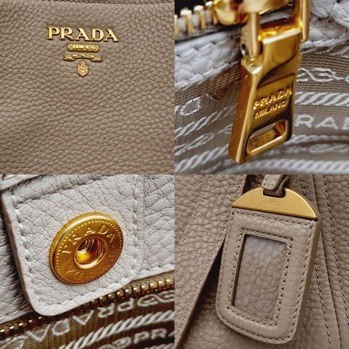 338 - A Prada Cream Leather Tote Bag. Dual flat handles, gold tone hardware. Exterior pocket to each side.... 