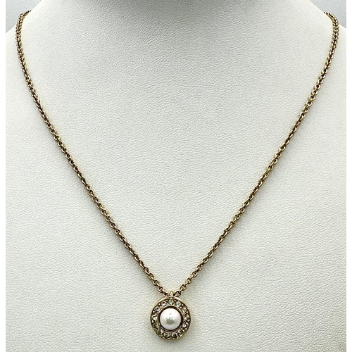 487 - A Gold Tone Christian Dior Pearl and Clear Stone Pendant Necklace. 45cm Length. Pendant Measures 1cm... 