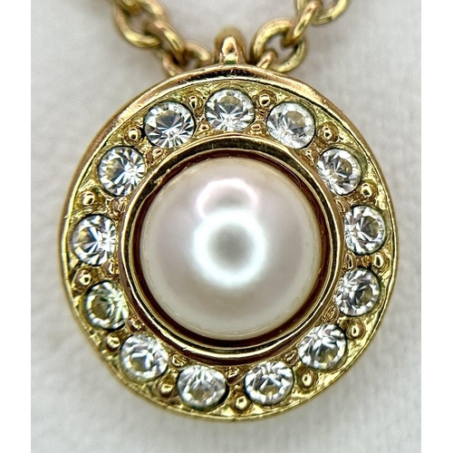 487 - A Gold Tone Christian Dior Pearl and Clear Stone Pendant Necklace. 45cm Length. Pendant Measures 1cm... 