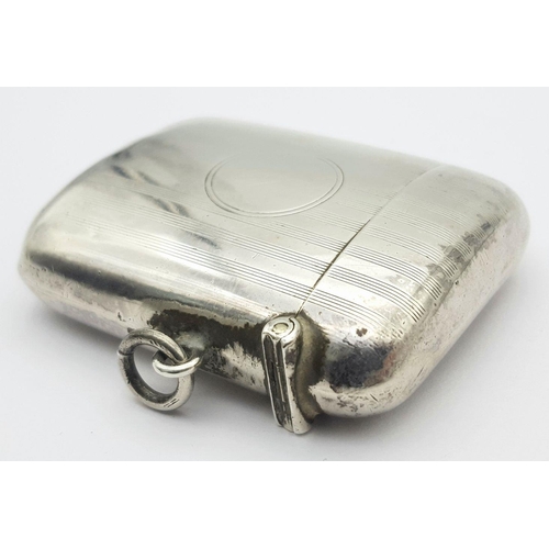 520 - An Antique Sterling Silver Vesta Case. Empty cartouche. Hinge works well. Birmingham 1912 hallmarks.... 