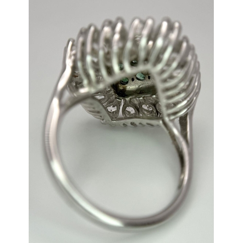 640 - A Limited-Edition Emerald and White Topaz Ring. Size S. 1 of 90 pieces made worldwide. Set with 0.73... 