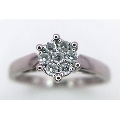 179 - A 18K WHITE GOLD DIAMOND CLUSTER RING 2.6G SIZE N.

ref: SC 2047